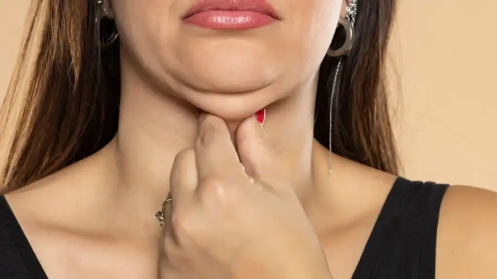 An image of a woman with double chin, sad, worried : Non Surgical Double Chin Removal Treatment in Stirling, UK